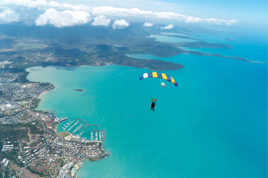 A tandem canopy over the turquoise water of the Whitsunday Islands